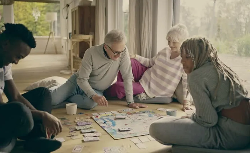 family playing board games living room